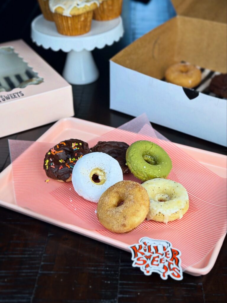 assorted vegan donuts on tray killer sweets modesto bakery