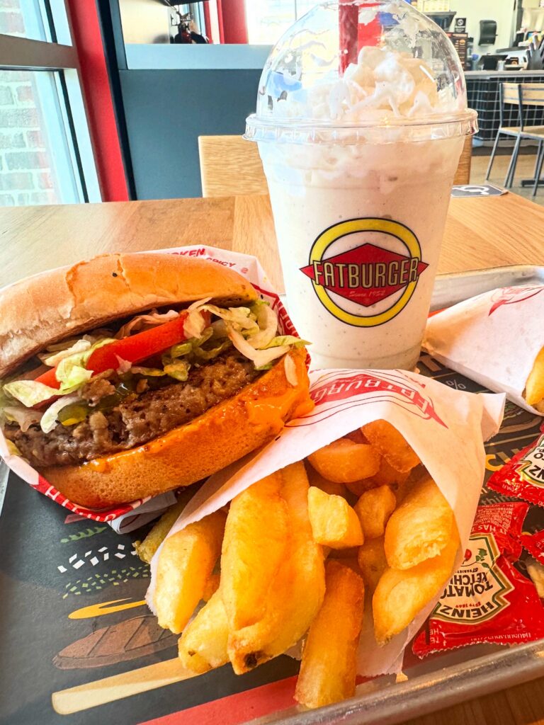 Vegan Impossible Burger with dairy-free cheddar cheese served with a Fatburger vegan milkshake and fries.