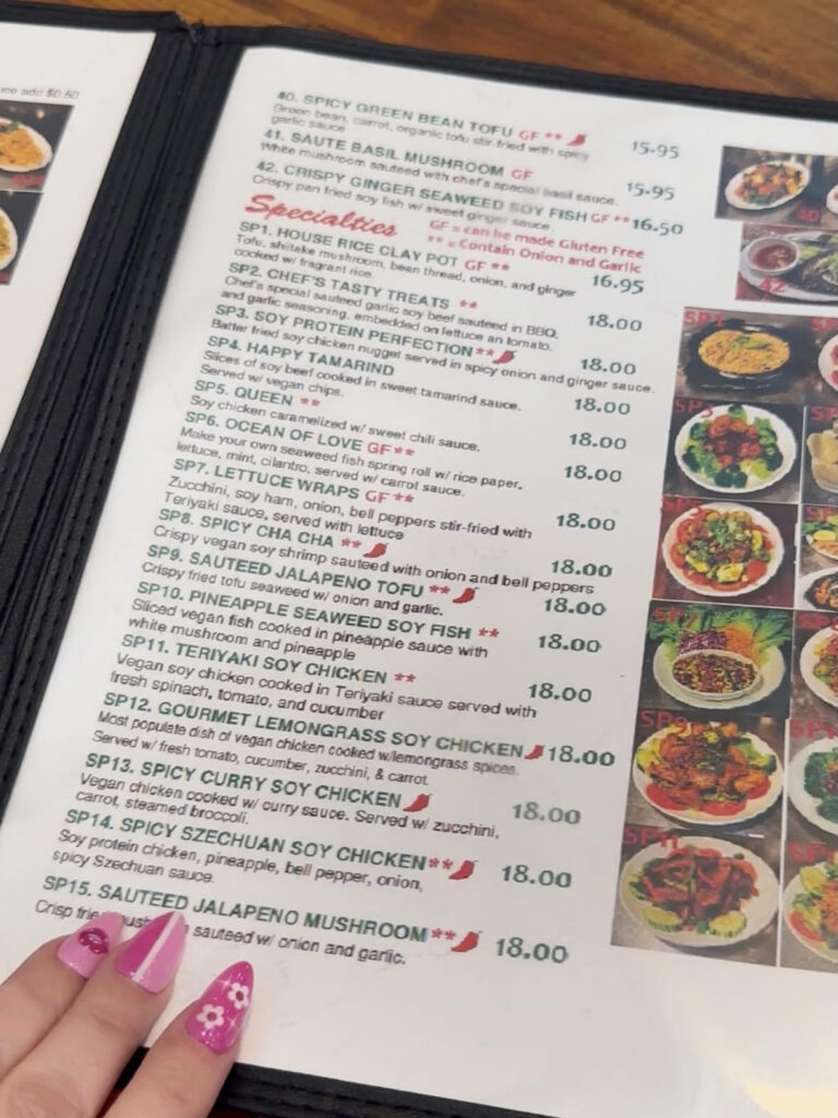Blossom Vegan menu section featuring chef specialties, rice dishes, curries, and plant-based protein entrées.