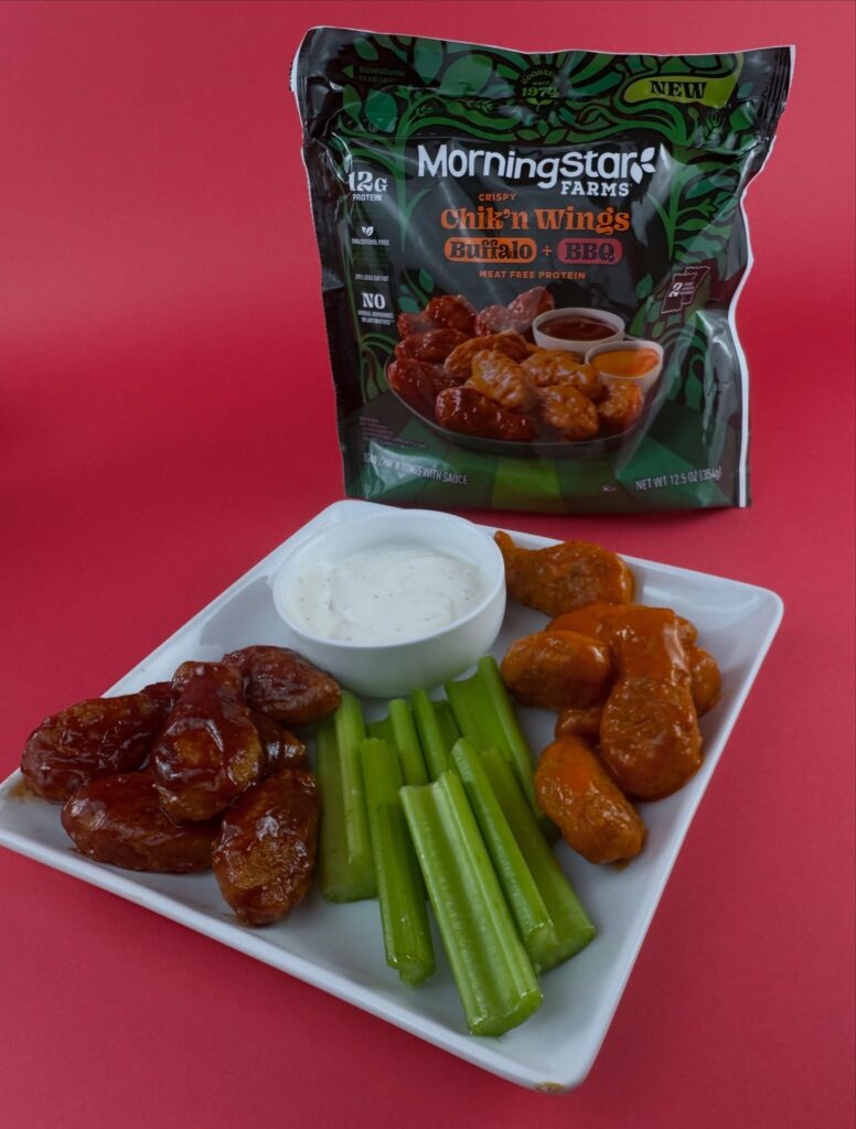 MorningStar Farms Buffalo and BBQ Chik'n Wings served with celery sticks, vegan ranch, and product package.