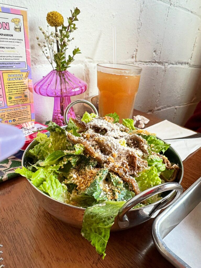 Vegan Caesar salad topped with oyster mushroom anchovies and parmesan at Fungi Foods in Oakland.