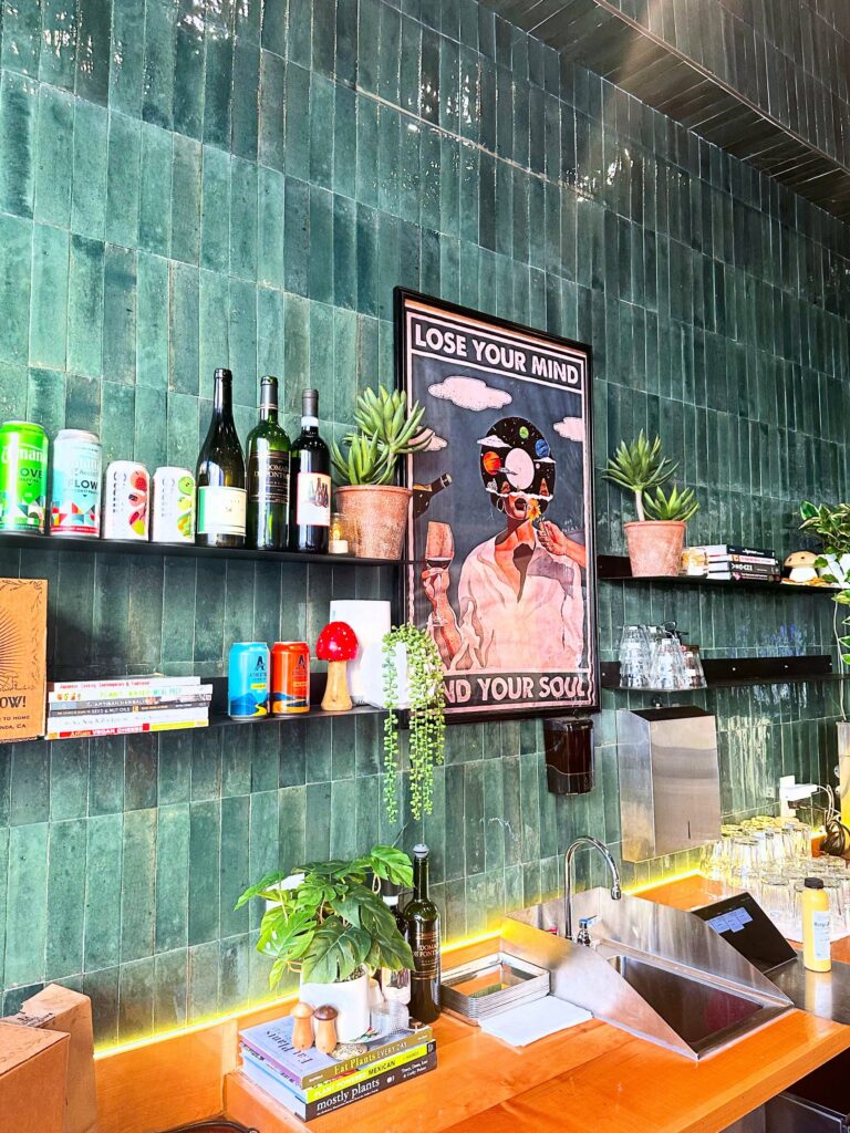 Colorful interior wall and bar display inside Fungi Foods restaurant in Oakland.