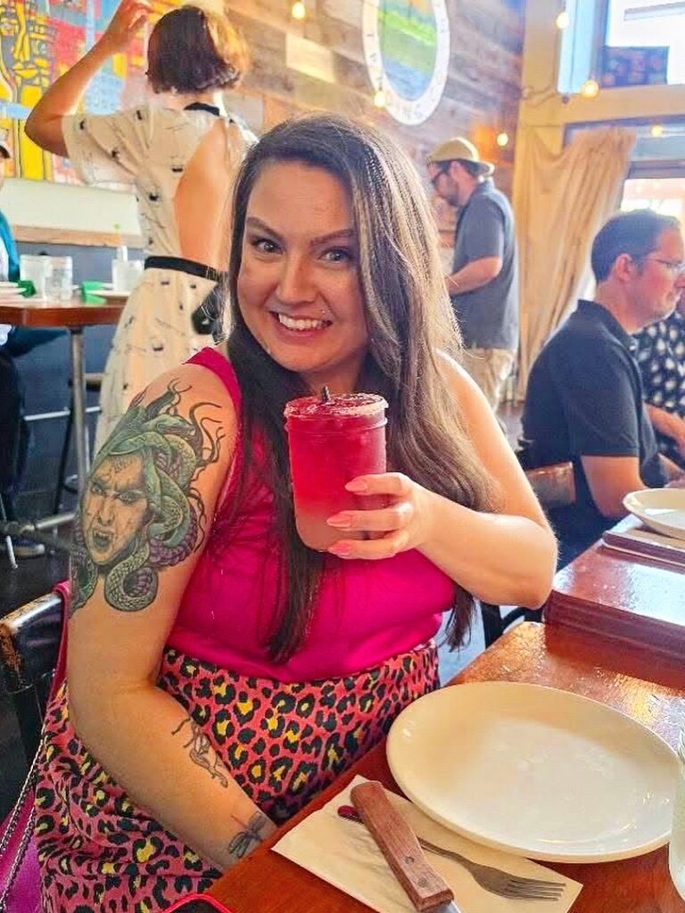 Your Neighborhood Vegan enjoying a pink Cast Iron Margarita during Vegan Roast at Cast Iron Trading Co. in Stockton.