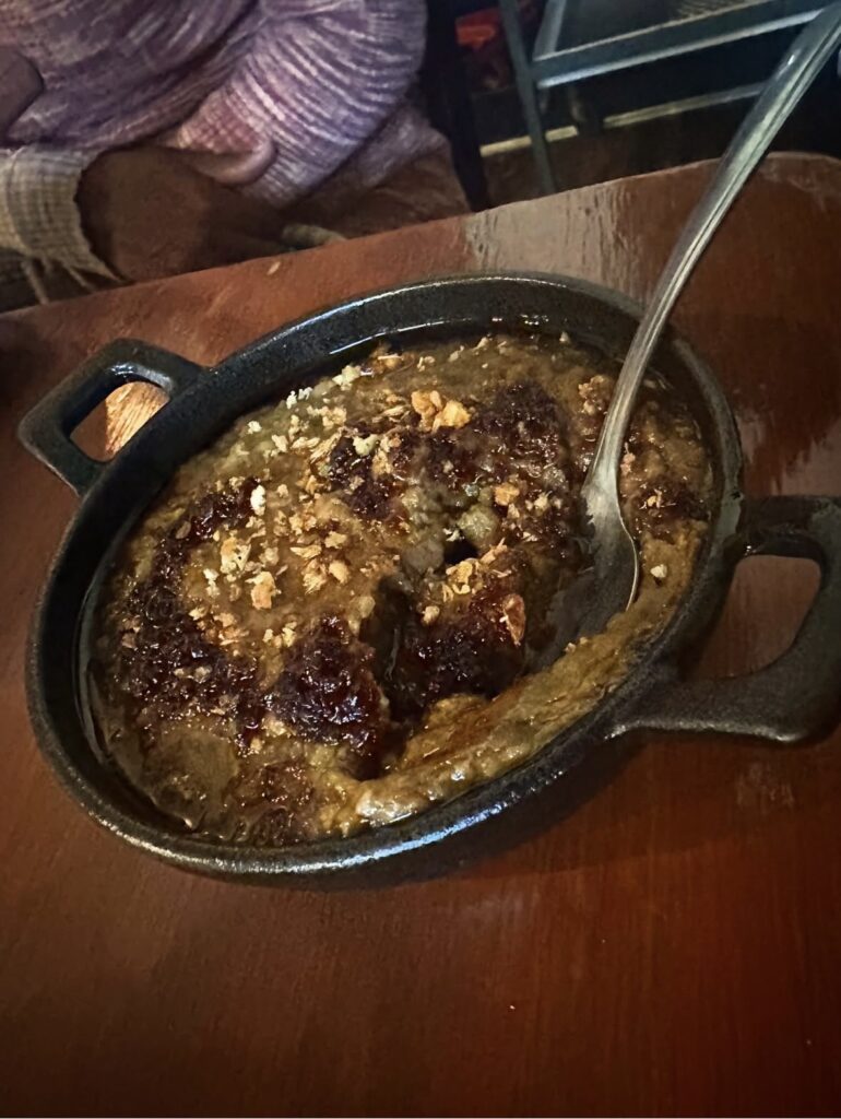 Creamy refried lentils topped with crispy garbanzos and garlic oil from the Vegan Roast six-course menu.