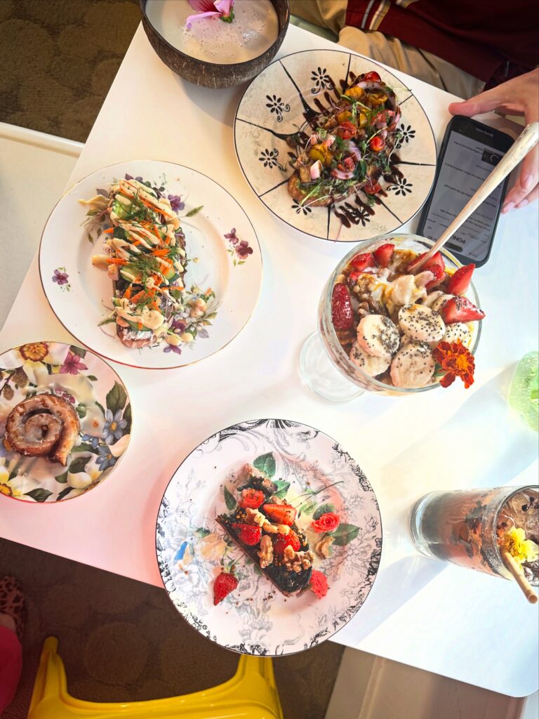 Vegan breakfast spread with loaded toasts, parfait and cinnamon roll at Alchemist Café in Modesto