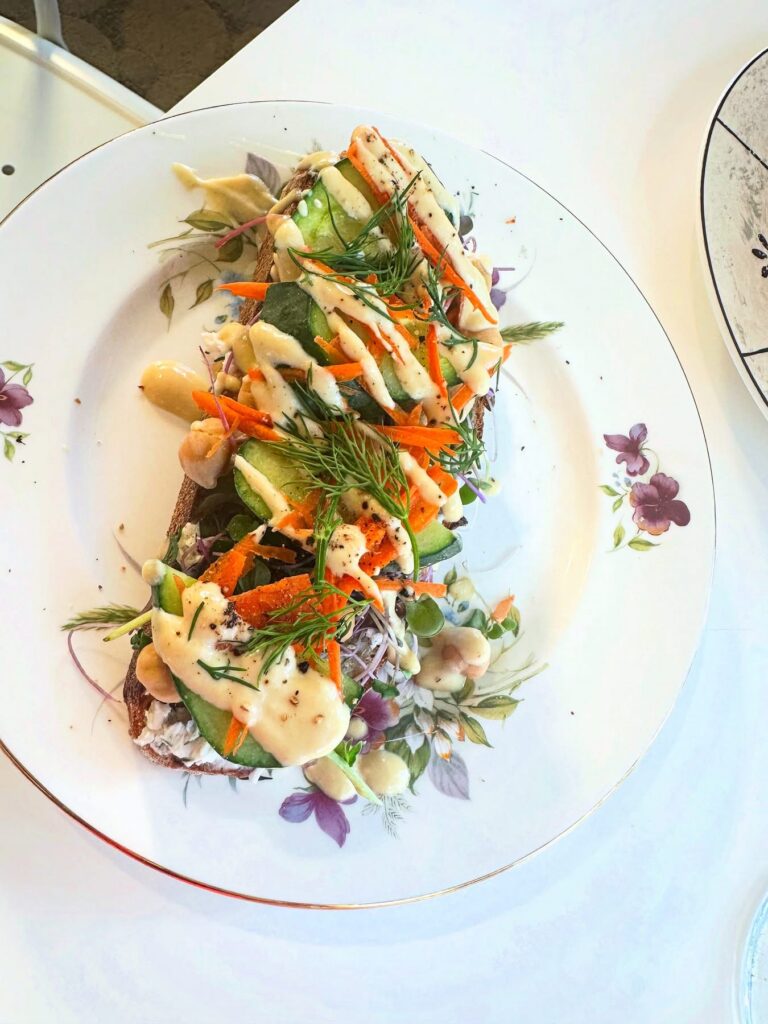 Harmony Toast with chickpeas, vegetables and lemon tahini at Alchemist Café in Modesto
