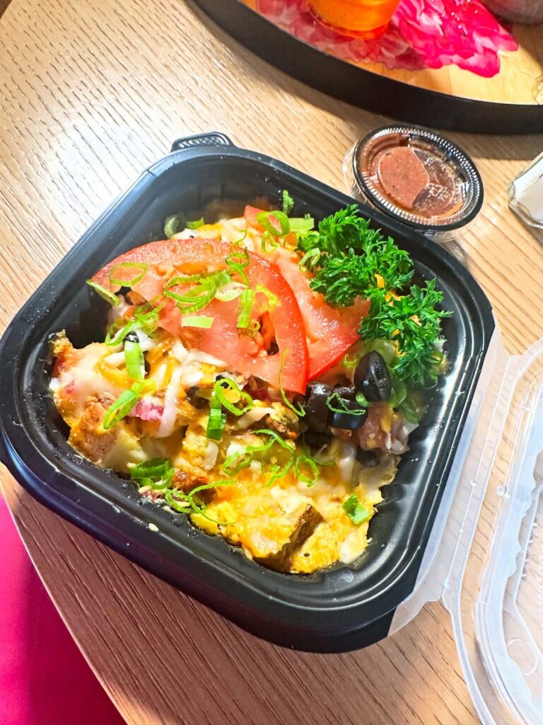 Vegan breakfast bowl with Just Egg, vegan cheese, soy chorizo, potatoes and salsa at Queen Bean in Modesto