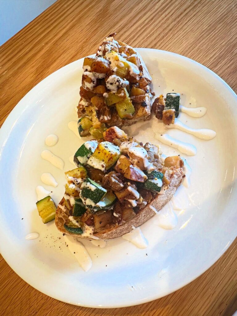Vegan Tartine with potatoes, seasonal squash, caramelized onions and vegan garlic aioli at Penny University
