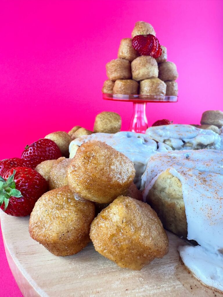 Glazed vegan gluten-free donut holes from Gluten Gone Goodies with strawberries and cinnamon rolls.
