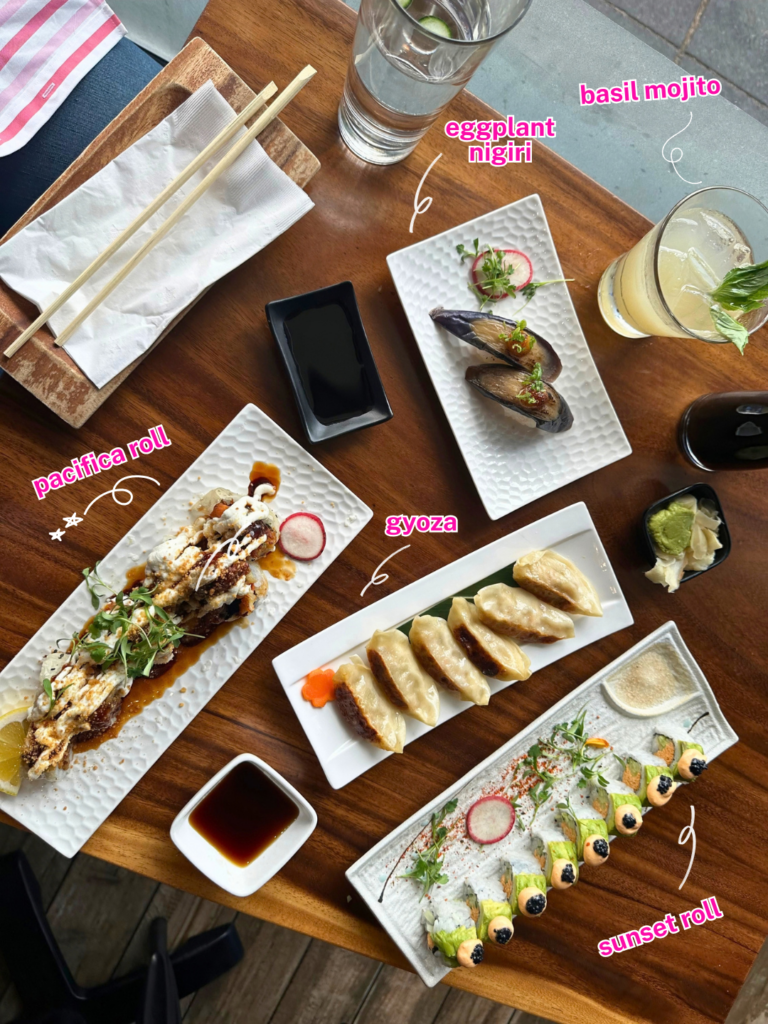 Vegan sushi, gyoza, eggplant nigiri and cocktails spread across the table at Tane Vegan Izakaya