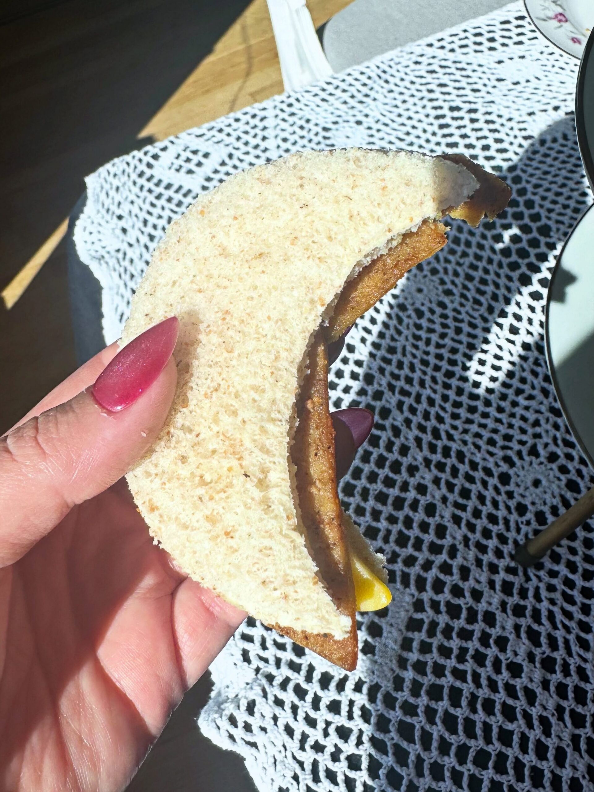 Crescent-shaped vegan ham and cheese finger sandwich from the Vegan Dollhouse tea party.