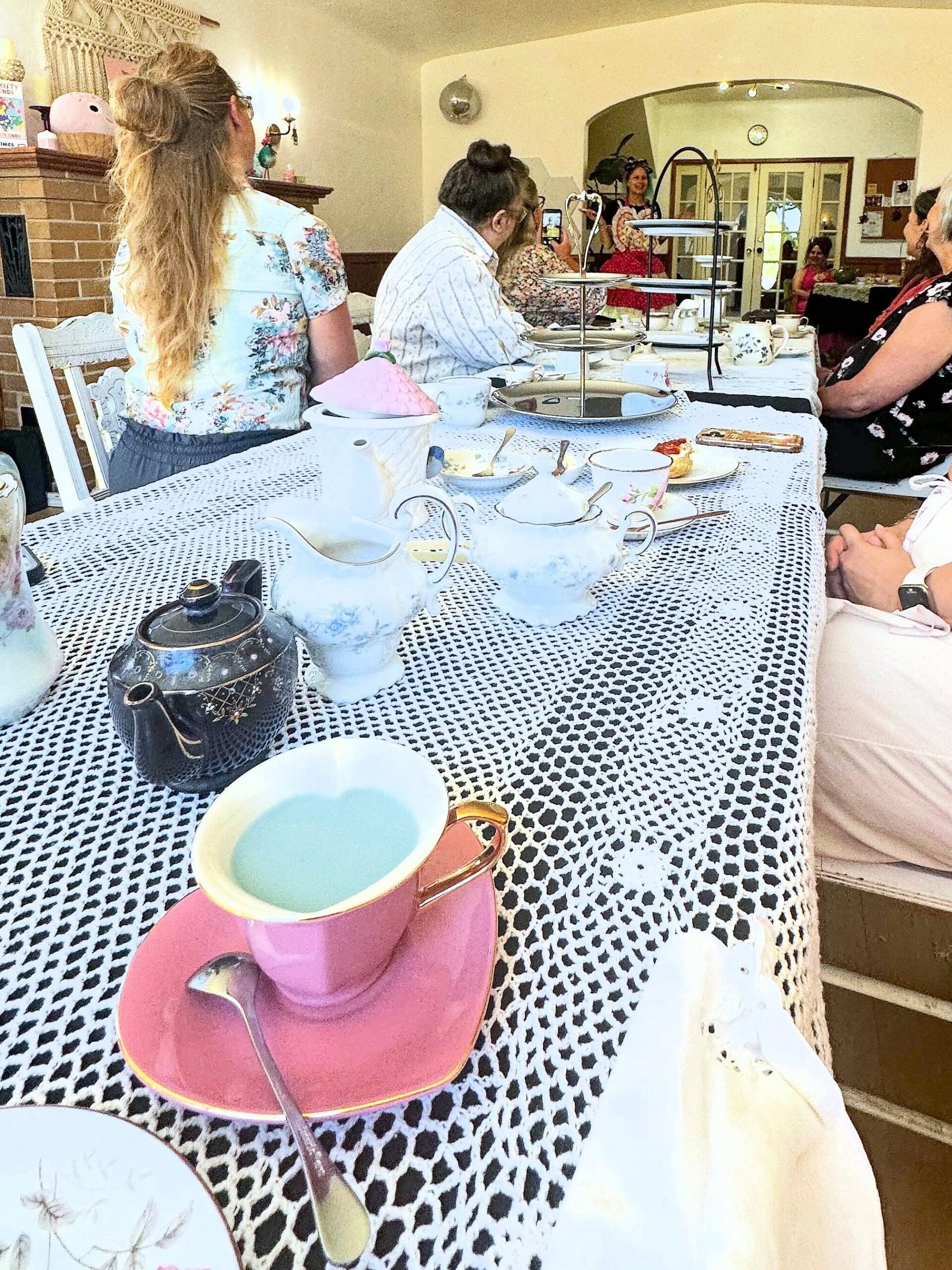 Tea party table set with colorful teacups, teapots, and place settings at Lady Bird Tea House in Fair Oaks.