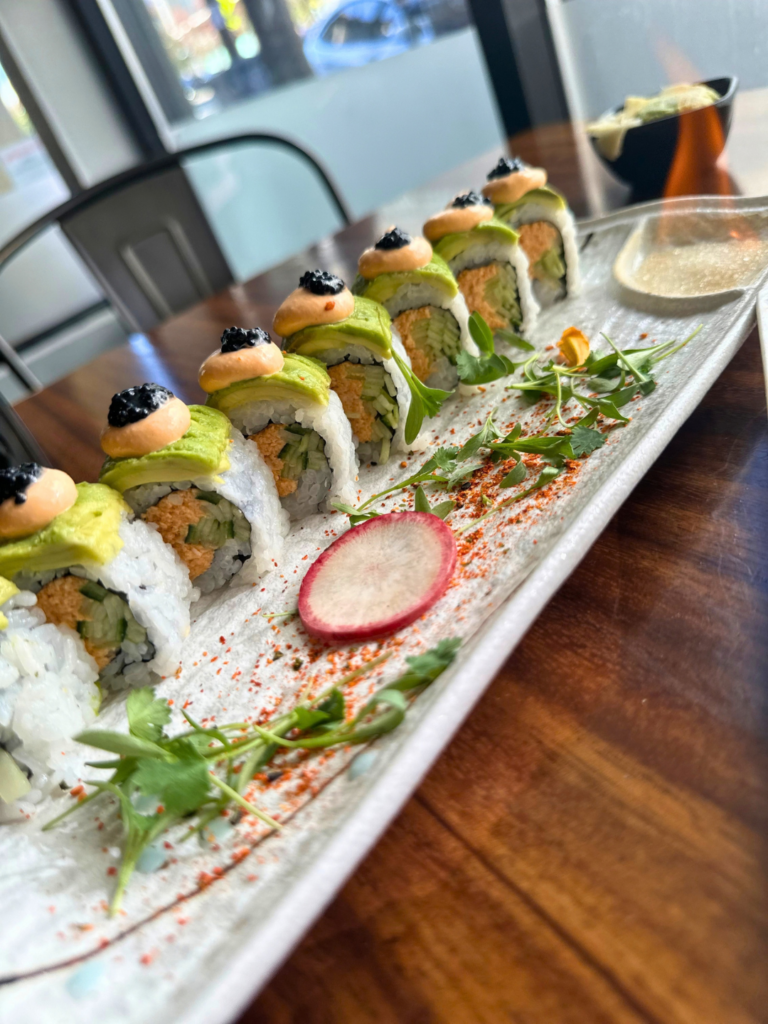 Close-up of the vegan Sunset Roll with plate on fire at Tane Vegan Izakaya in Berkeley
