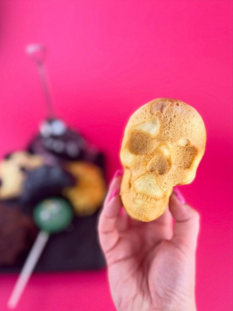 Vegan skull-shaped pizza from Vegan Dollhouse filled with pepperoni and cheese for Halloween.