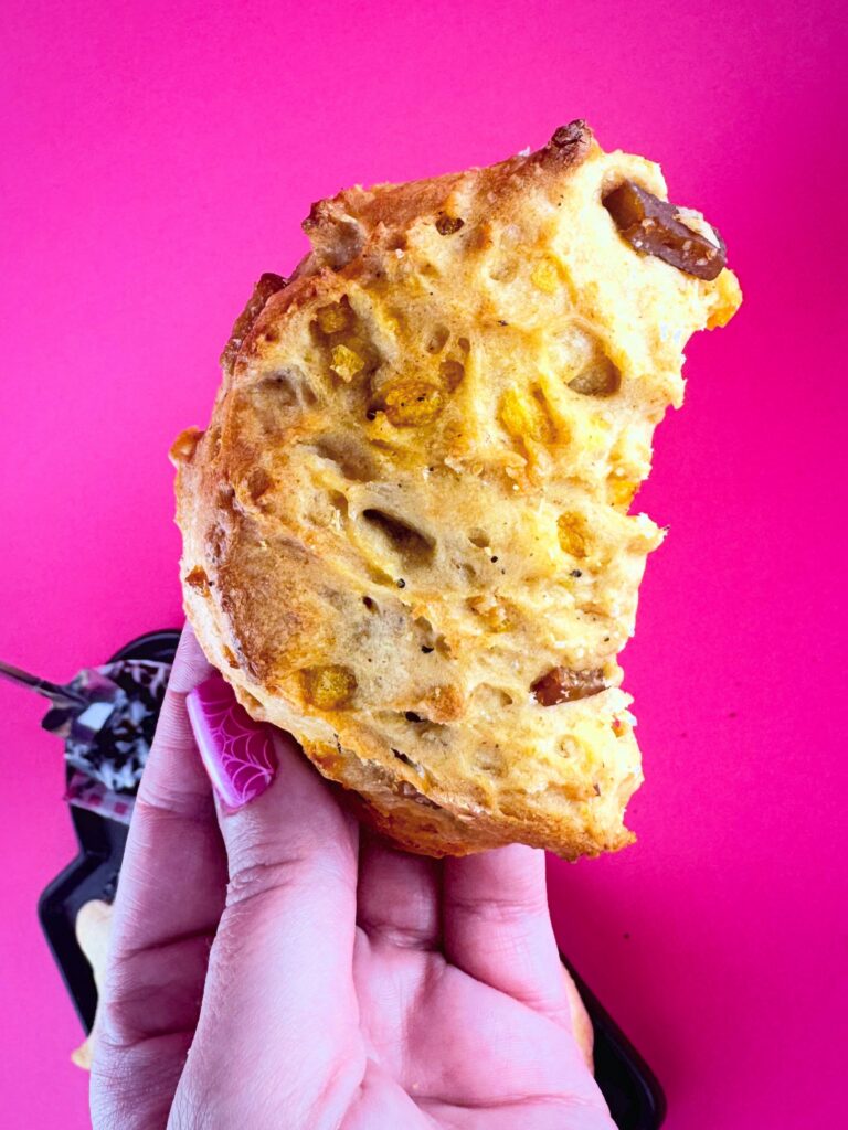 White savory crescent moon scone with vegan bacon and cheddar from Vegan Dollhouse.