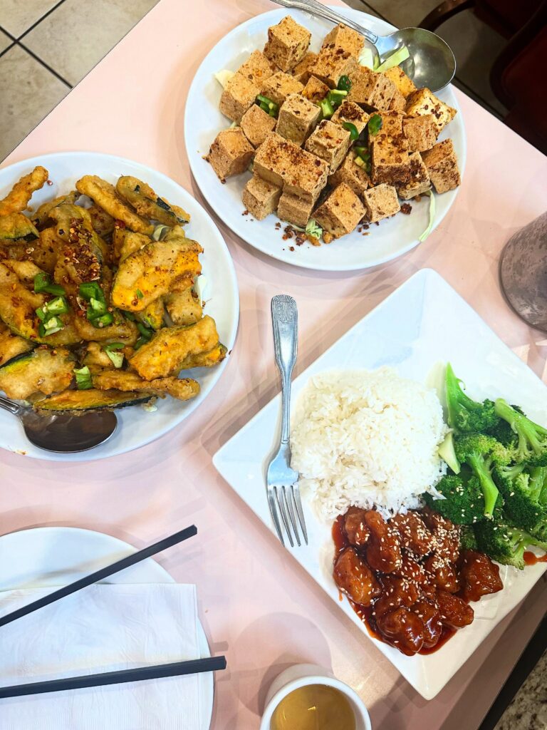 Overhead view of salt and pepper tofu, salt and pepper pumpkin, vegan sesame chicken, rice, and broccoli at Veggie Lee in Hayward
