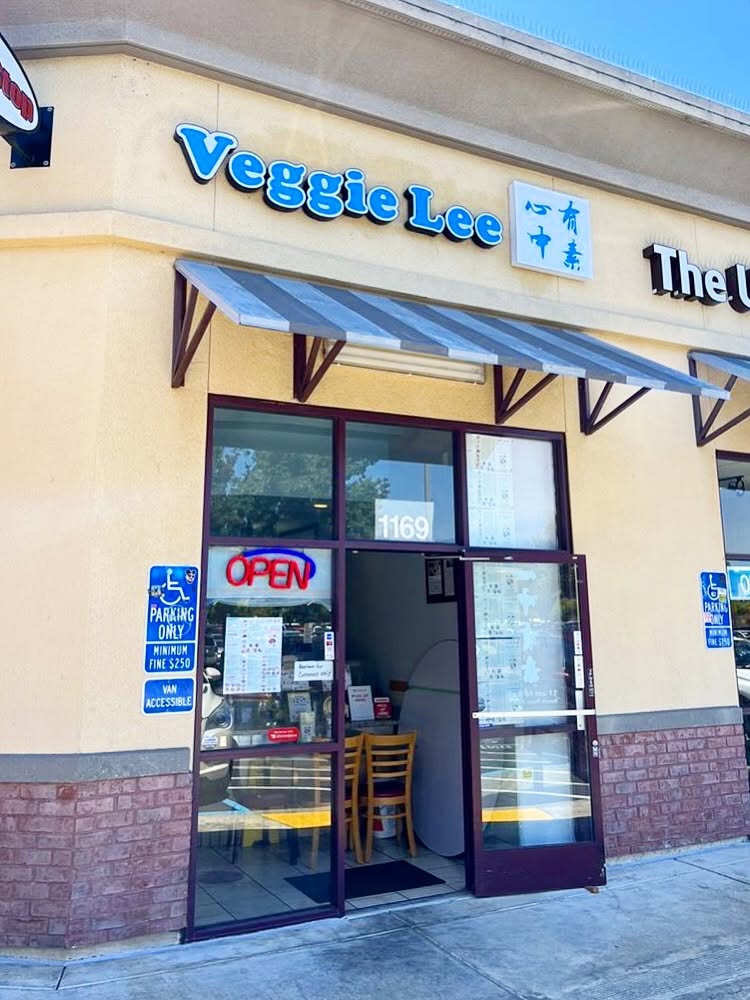 Exterior entrance and blue Veggie Lee sign at the vegetarian Chinese restaurant in Hayward, California