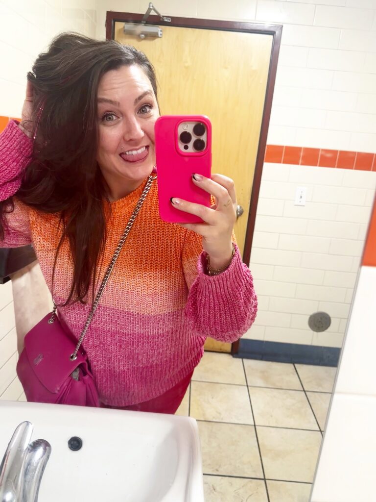 Your Neighborhood Vegan food blogger taking a mirror selfie during a visit to Veggie Lee in Hayward